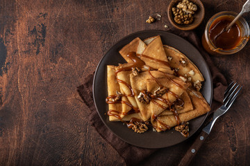 crepes with salted caramel and nuts - obrazy, fototapety, plakaty