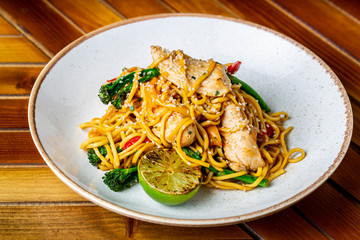 Teriyaki noodle bowl with chicken and greens 
