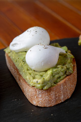 Topped Bread with different toppings salmon cream cheese, eggs avocado eggs