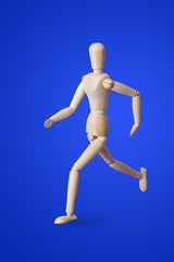Sports wooden toy figure on blue