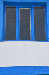 blue window on a wall