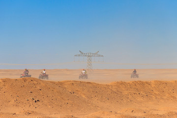 Safari trip through egyptian desert driving ATV. Quad bikes safari in the desert near Hurghada, Egypt