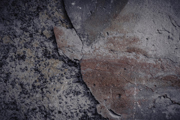 The texture of the old yellow stone wall with chinks. Cropped shot, close-up, nobody, vertical