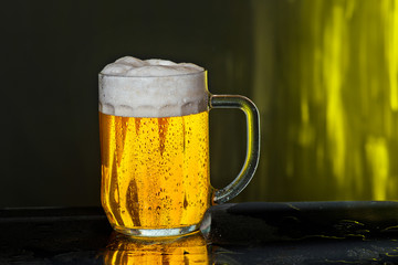 Glass of beer with drops of water
