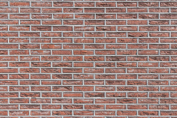 red brick wall with extruded mortar joints