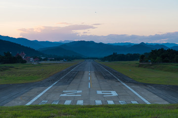 Airport runway sunset.