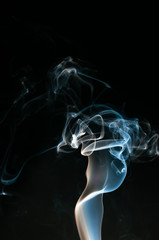Isolated white and blue smoke on black background. Design element. Natural smoke.