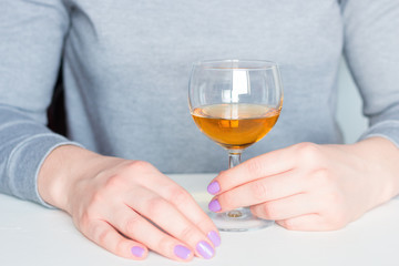 woman and a glass with alcohol