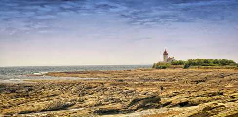 lighthouse on coast of sea