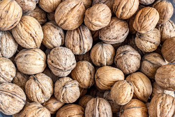 Natural walnut background pattern texture. Abstract walnuts heap pattern background.