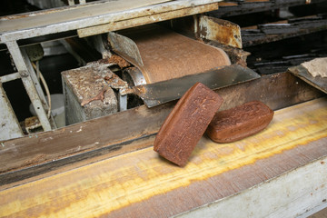 Manufacture of bread. Conveyor with dough. Capacity of the dough. Kneading dough at the bakery. Workshop of the manufacture dough.