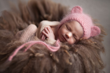 Closeup infant baby girl sleeping at background. Newborn and mothercare concept
