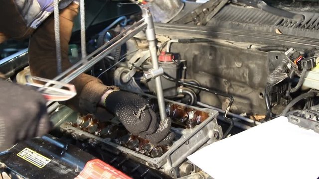 Mechanic repairs the car engine