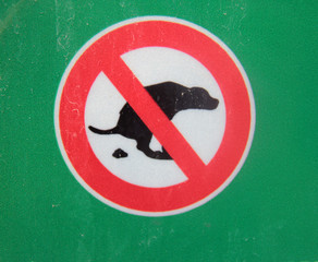 dog walking is prohibited, a red round sign with a crossed-out image of a pooping dog in black on a...