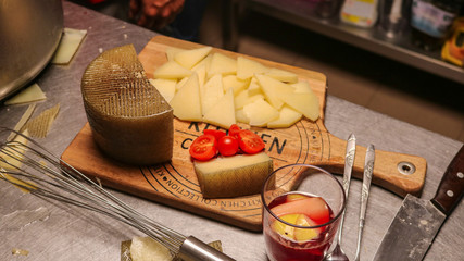 Cheese, tomatoes and sangria on a mat