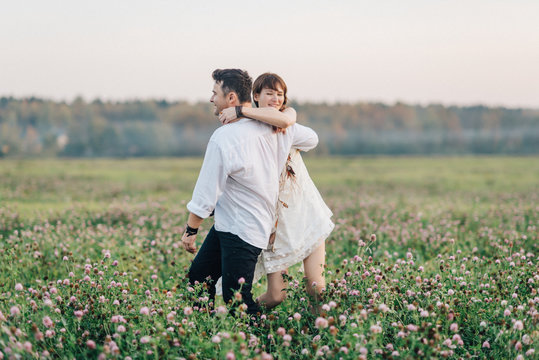 Love story of beautiful young couple at nature