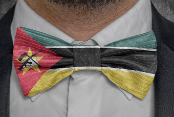 National flag of Mozambique on bowtie business man suit