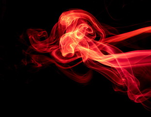 Red smoke on black background
