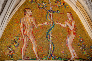 Bible scene of Genesis with Adam and Eva at major entrance portal of Saint Vitus Cathedral in...