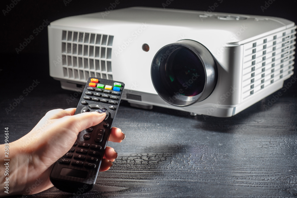 Poster lcd video projector with remote control. multimedia projector. equipment for presentations. projecti