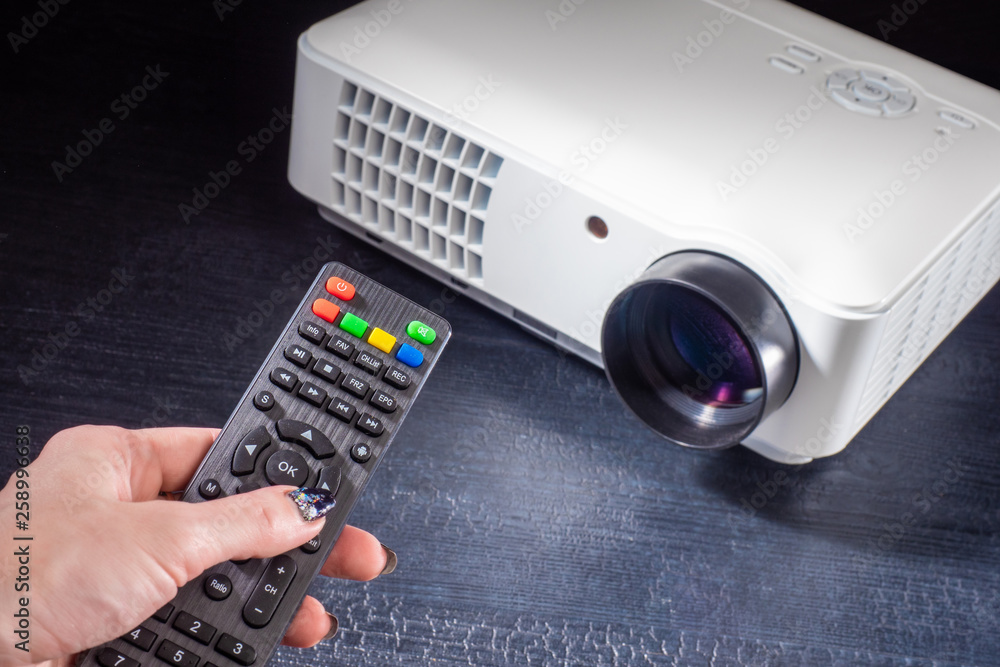 Poster lcd video projector with remote control. digital projector. equipment for presentations. projection 