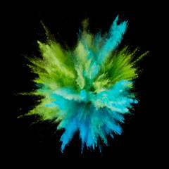 Colored powder explosion. Abstract closeup dust on backdrop. Colorful explode. Paint holi
