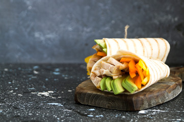 Burrito with grilled chicken and vegetables (fajitas, pita bread, Shawarma)