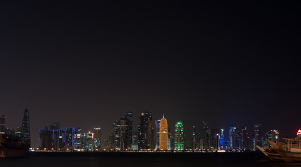 Fototapeta na wymiar Doha city skyline night view, Qatar. view of the night city. free palce for text. night sky, high-rise buildings, luxury luminous buildings