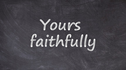 Yours faithfully written on blackboard