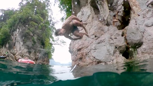 Travel Thailand Having Fun Cliff Jumping In Cheow Lan Lake Khao Sok  slow -motion