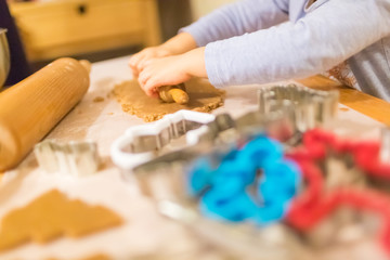 Obraz na płótnie Canvas Baking with the family - Mother and daughter making self made cookies in a home kitchen