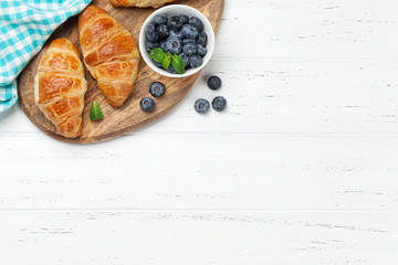 Fresh croissants and berries