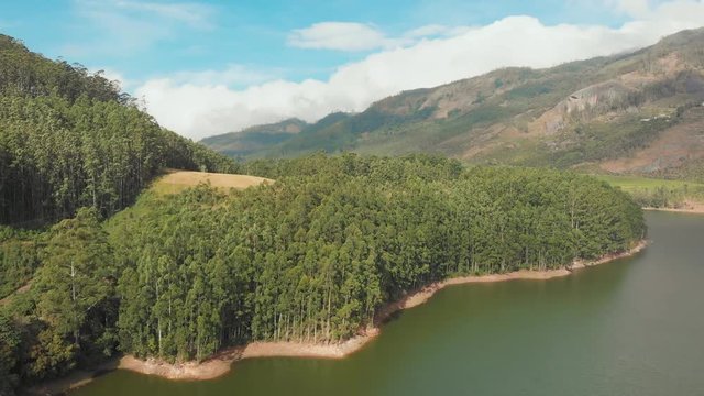 Aerial view beautiful nature with mountains and hills by Lake Mattupetty. Kerala State. Near the city of Munar.