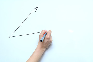 in the female hand a marker with which she draws an arrow of success