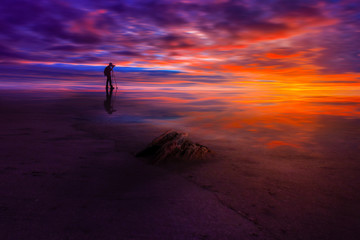 the movement of clouds and water when the beauty of the sky is blue and red at sunset in the sea with a photographer who captures in Indonesia natural beauty of bengkulu utara 