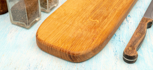 Wooden oak cutting board. Kitchenware. Copy space.