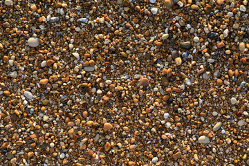 Pebbles mixed with sand of the beautiful Skala beach, Kefalonia island, Ionian sea, Greece.