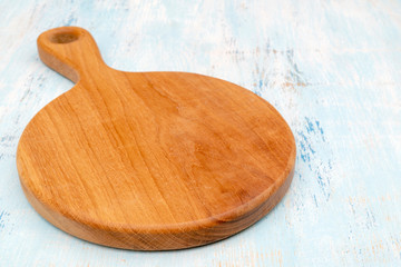 Wooden oak cutting board. Kitchenware. Copy space.