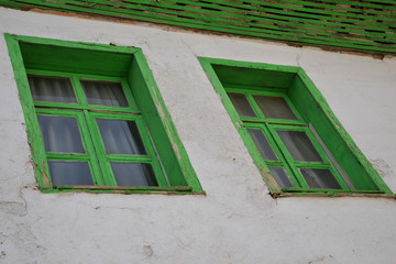 green window on a wall
