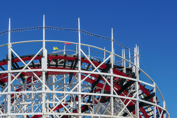 Old wood vintage roller coaster, amusement park.