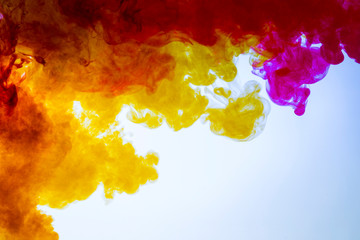 red with burgundy and yellow colors mixed in water