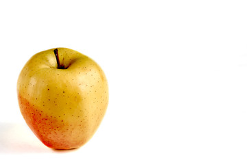 Apple yellow with red side on a white background with a place for an inscription