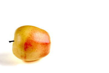 Apple yellow with red side on a white background with a place for an inscription