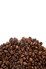 Coffee grains scattered on a white background with a place for an inscription.