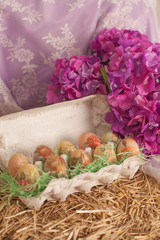 easter eggs painted hay lilac background