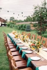 Table settings for a luxury wedding reception. Outdoor wedding