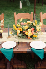 Table settings for a luxury wedding reception. Outdoor wedding