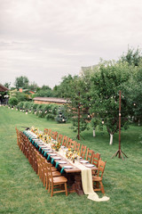 Table settings for a luxury wedding reception. Outdoor wedding