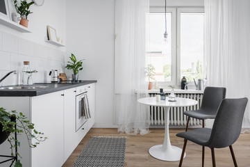 White kitchenette with table