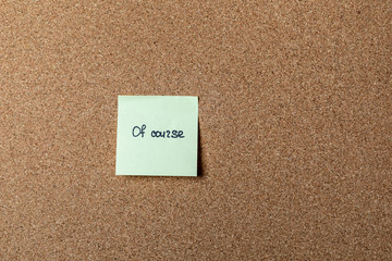 green sticker on brown table. color sticker, motivational, quote, and words, note, message of course